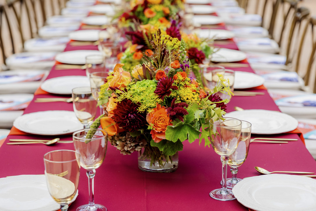 Dinner table with colorful floral centerpiece