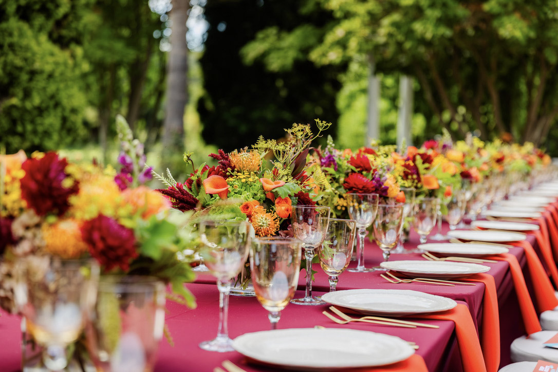 Long garden dinner table with autumn flowers